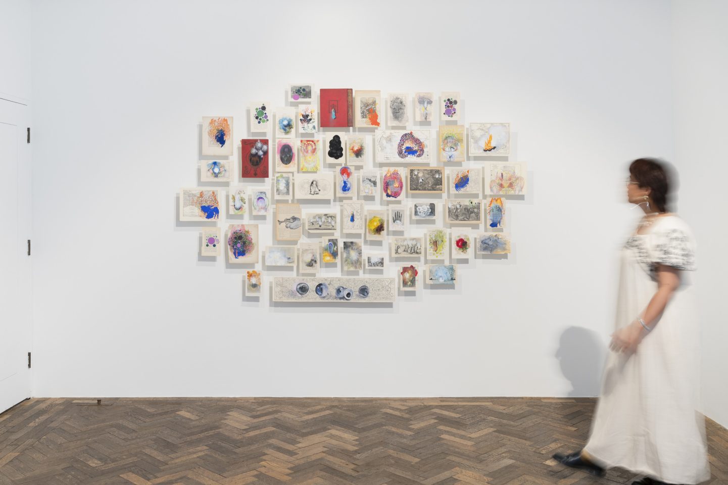 Wall of book pages painted over